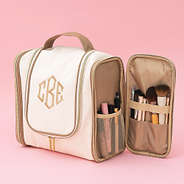 side pocket of hanging ivory monogrammed toiletry bag