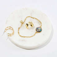 initial bracelet on marble dish