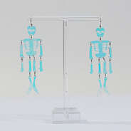 skeleton earrings on stand