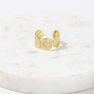 gold cuff ring on marble