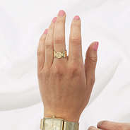 girl wearing gold cuff ring