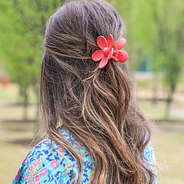 hot pink hair claw clip half up half down style