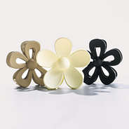 studio shot of neutral flower hair clips