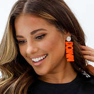 orange touchdown earring on one ear