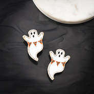 ghost earrings on black background