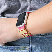 hot pink band and apple watch charms in gold leopard