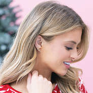 christmas candy cane earrings in ear