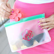 teal airtight dry bag with beach accessories