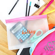 pink airtight dry bag with school supplies