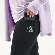 black colorblock monogrammed leggings with phone in pocket