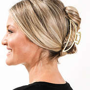 gold hair clip set in hair