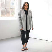 Plus model wearing gray sweatshirt cardgian