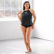 Plus model wearing high neck tankini