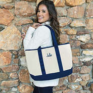 girl with navy personalized boat tote bag over shoulder