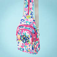 watercolor cheetah sling backpack on blue background