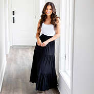 black midi skirt on Peyton in hallway