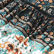 close up of black paisley midi skirt fabric