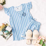 blue and white monogrammed ruffle pajama set with ivory fuzzy slippers