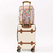 packable backback shown on a suitcase