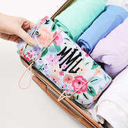 personalized french floral toiletry kit in luggage