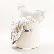 ivory storage basket with blanket and pillow