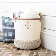 tan and ivory storage basket on porch