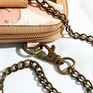 close up of lobster claw clip attached to phone wallet wristlet