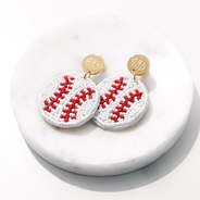 baseball earrings on white marble