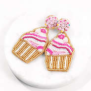 cupcake earrings on marble