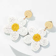 ivory flower earrings in studio