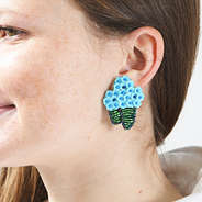 blue hydrangea earring in ear