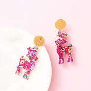 multi reindeer earrings on pink background