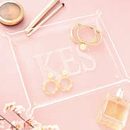 gold scallop earrings and cable bracelet stack on acrylic tray