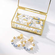 gold bracelet and monogrammed earrings coastal set in gold box