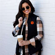 Brunette wearing black clemson puffer vest