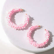 pink flower hoop earrings in studio