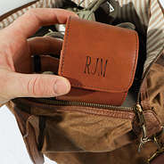 travel watch roll being placed into a weekender