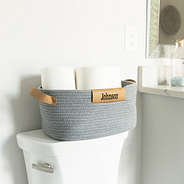 gray basket in bathroom