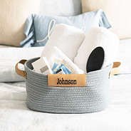 gray basket on bed