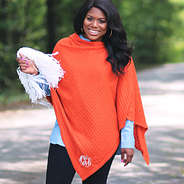 monogrammed orange poncho with pom pom