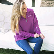girl wearing monogrammed faith pullover in orchid