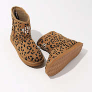 studio shot of leopard print sherpa boots