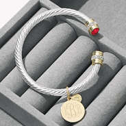 monogrammed july birthstone cable bracelet on jewelry box