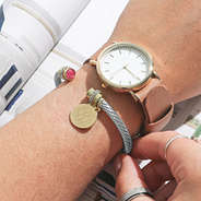 october monogrammed birthstone cable on wrist with watch