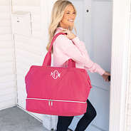 girl with waxed canvas hot pink monogrammed weekender over shoulder