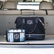 clear large toiletry bag and canvas weekender in black in car