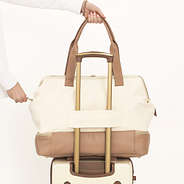 ivory canvas weekender on vintage suitcase