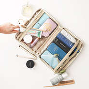 ivory travel toiletry bag inside shot on white backdrop