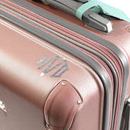 2 inch sticker on top of suitcase