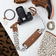 leopard camera strap flatlay - 2025